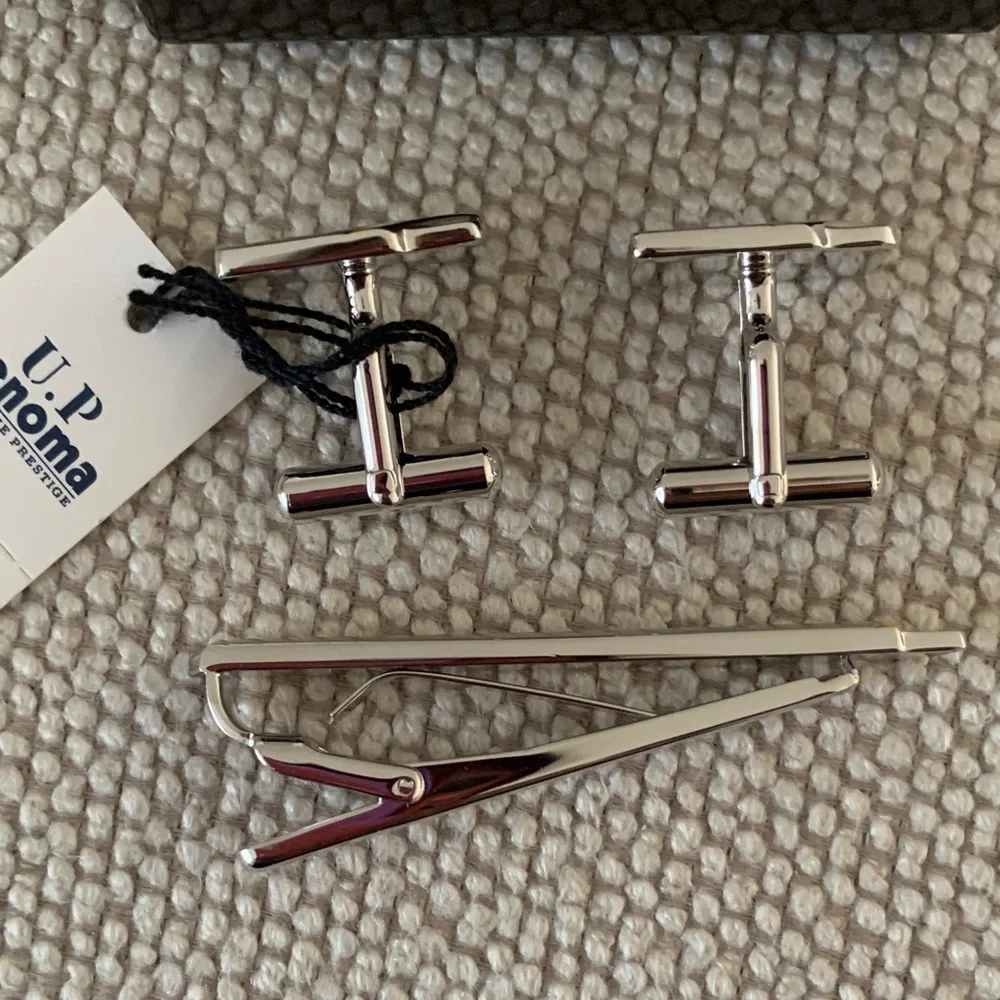 U.P. RENOMA Silvertone Cufflinks and Tie Clip Set